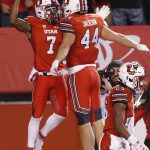 Utah wide receiver Demari Simpkins (7) celebrates with Jake Jackson (44) after catching a pass for a touchdown against Arizona during the first half of an NCAA college football game Friday, Oct. 12, 2018, in Salt Lake City. (AP Photo/Rick Bowmer)