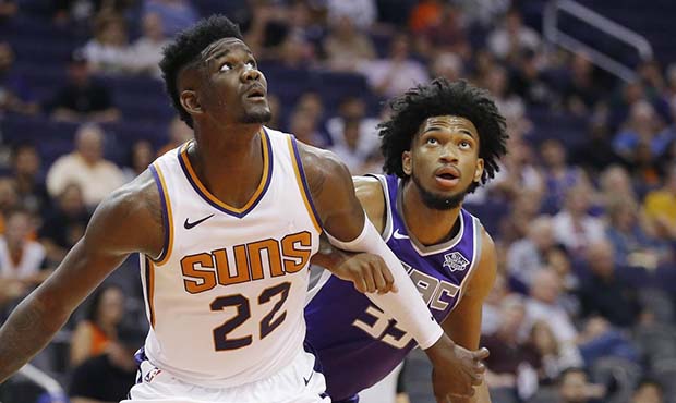 Phoenix Suns center Deandre Ayton (22) boxes out Sacramento Kings forward Marvin Bagley III, right,...