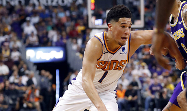 Phoenix Suns guard Devin Booker (1) drives against the Los Angeles Lakers during the second half of...