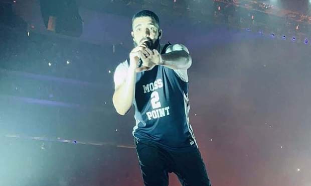 Drake dons a Devin Booker Moss Point jersey during Arizona concert