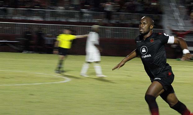 Some things never change. Didier Drogba celebrates his free kick goal in the Phoenix Rising's playo...