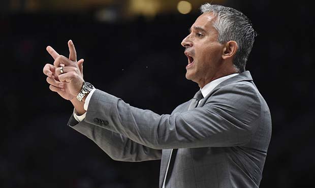 Phoenix Suns coach Igor Kokoskov signals to his team during the first half of an NBA preseason bask...
