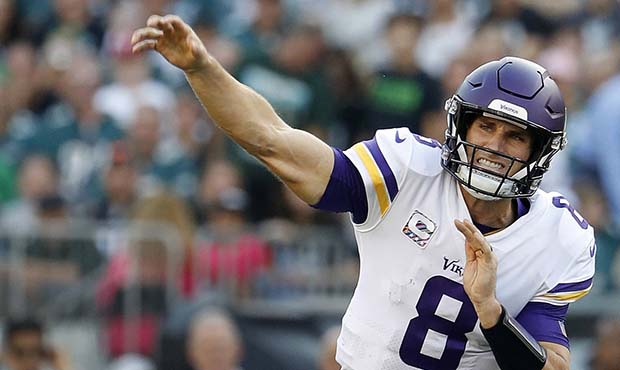 FILE - In this Oct. 7, 2018, file photo, Minnesota Vikings quarterback Kirk Cousins throws during a...