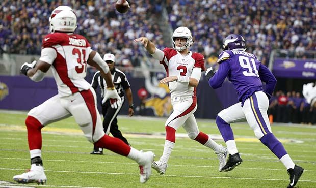 Arizona Cardinals quarterback Josh Rosen (3) throws a pass as he is pressured by Minnesota Vikings ...
