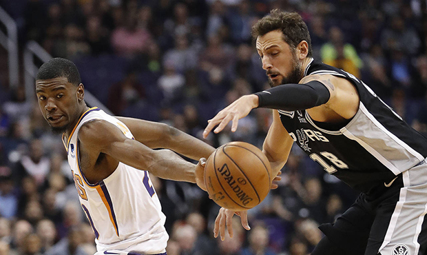San Antonio Spurs guard Marco Belinelli (18) steals the ball from Phoenix Suns forward Josh Jackson...