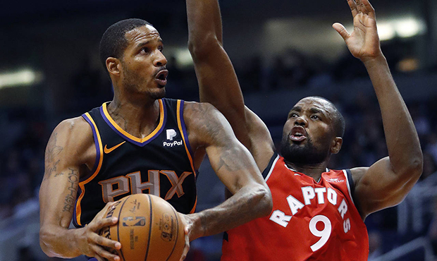 Phoenix Suns forward Trevor Ariza drives past Toronto Raptors forward Serge Ibaka (9) during the se...