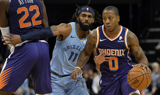Phoenix Suns guard Isaiah Canaan (0) drives against Memphis Grizzlies guard Mike Conley (11) in the...