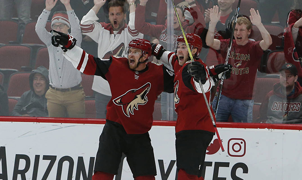 Arizona Coyotes right wing Michael Grabner, left, celebrates with Jordan Oesterle (82) after scorin...