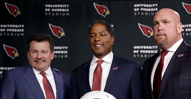 Newly appointed Arizona Cardinals football head coach Steve Wilks, center, poses for photographers ...