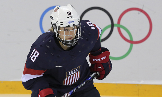 Lyndsey Fry of the United States skates during the 2014 Winter Olympics women's ice hockey game aga...