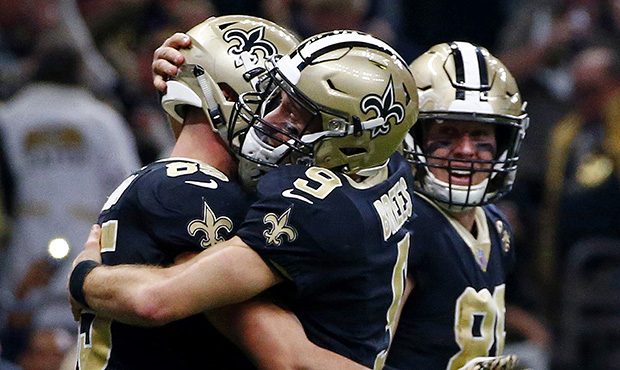 New Orleans Saints quarterback Drew Brees (9) hugs tight end Dan Arnold (85) after the two connecte...