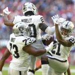 Oakland Raiders cornerback Gareon Conley (21) celebrates his interception with defensive tackle Maurice Hurst (73) and cornerback Daryl Worley (20) during the first half of an NFL football game against the Arizona Cardinals, Sunday, Nov. 18, 2018, in Glendale, Ariz. (AP Photo/Ross D. Franklin)