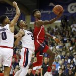 Arizona guard Brandon Randolph (5) goes for a lay up while being guarded by Gonzaga guard Geno Crandall (0) and guard Zach Norvell Jr. (23) during the first half of an NCAA college basketball game against at the Maui Invitational, Tuesday, Nov. 20, 2018, in Lahaina, Hawaii. (AP Photo/Marco Garcia)
