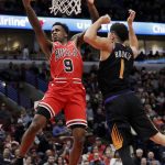 Chicago Bulls guard Antonio Blakeney, left, drives to the basket against Phoenix Suns guard Devin Booker during the second half of an NBA basketball game Wednesday, Nov. 21, 2018, in Chicago. The Bulls won 124-116. (AP Photo/Nam Y. Huh)