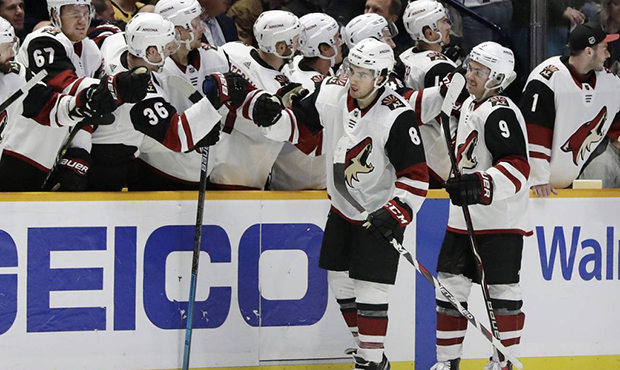 Arizona Coyotes center Nick Schmaltz (8) is congratulated after scoring a goal against the Nashvill...