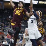 Arizona State 's Taeshon Cherry (35) dunks over Utah State's John Knight III during the second half of an NCAA college basketball game Wednesday, Nov. 21, 2018, in Las Vegas. (AP Photo/John Locher)