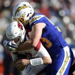 Arizona Cardinals quarterback Josh Rosen, left, is sacked by Los Angeles Chargers defensive end Joey Bosa during the first half of an NFL football game Sunday, Nov. 25, 2018, in Carson, Calif. (AP Photo/Kelvin Kuo )