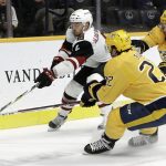 Arizona Coyotes defenseman Niklas Hjalmarsson (4), of Sweden, chases after the puck with Nashville Predators left wing Kevin Fiala (22), of Switzerland, and center Ryan Johansen (92) in the second period of an NHL hockey game Thursday, Nov. 29, 2018, in Nashville, Tenn. (AP Photo/Mark Humphrey)