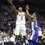 Phoenix Suns' Jamal Crawford (11) drives to the basket past Philadelphia 76ers' Jimmy Butler (23) in the first half of an NBA basketball game, Monday, Nov. 19, 2018, in Philadelphia. (AP Photo/Michael Perez)