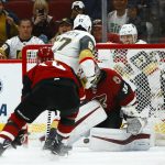 Vegas Golden Knights left wing Max Pacioretty (67) scores against Arizona Coyotes goaltender Darcy Kuemper (35) as he gets past Coyotes right wing Richard Panik (14) during overtime in an NHL hockey game Wednesday, Nov. 21, 2018, in Glendale, Ariz. The Golden Knights defeated the Coyotes 3-2. (AP Photo/Ross D. Franklin)