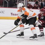Philadelphia Flyers' Nolan Patrick (19) controls the puck against the Arizona Coyotes' Oliver Ekman-Larsson (23) during the first period of an NHL hockey game Monday, Nov. 5, 2018, in Glendale, Ariz. (AP Photo/Darryl Webb)