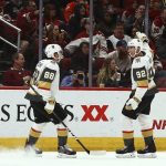 Vegas Golden Knights left wing Tomas Nosek (92) celebrates his goal against the Arizona Coyotes with defenseman Nate Schmidt (88) during the second period of an NHL hockey game Wednesday, Nov. 21, 2018, in Glendale, Ariz. (AP Photo/Ross D. Franklin)
