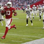 Arizona Cardinals wide receiver Christian Kirk (13) runs for a touchdown after the catch against the Oakland Raiders during the first half of an NFL football game, Sunday, Nov. 18, 2018, in Glendale, Ariz. (AP Photo/Ross D. Franklin)