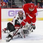 Arizona Coyotes goaltender Darcy Kuemper (35) stops a Detroit Red Wings center Andreas Athanasiou (72) shot in the second period of an NHL hockey game Tuesday, Nov. 13, 2018, in Detroit. (AP Photo/Paul Sancya)