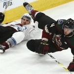 Arizona Coyotes defenseman Niklas Hjalmarsson (4) collides with Colorado Avalanche center Alexander Kerfoot, left, during the third period of an NHL hockey game Friday, Nov. 23, 2018, in Glendale, Ariz. (AP Photo/Ross D. Franklin)