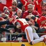 Kansas City Chiefs wide receiver Tyreek Hill (10) leaps into the stands after scoring a touchdown against the Arizona Cardinals during the first half of an NFL football game in Kansas City, Mo., Sunday, Nov. 11, 2018. (AP Photo/Charlie Riedel)