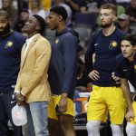 Indiana Pacers guard Victor Oladipo, in street clothes, watches the final second of the second half of an NBA basketball game with teammates against the Phoenix Suns, Tuesday, Nov. 27, 2018, in Phoenix. The Pacers won 109-104. (AP Photo/Matt York)