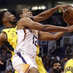 Phoenix Suns forward T.J. Warren (12) is fouled by Indiana Pacers forward Thaddeus Young during the second half of an NBA basketball game, Tuesday, Nov. 27, 2018, in Phoenix. The Pacers won 109-104. (AP Photo/Matt York)