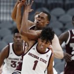 Arizona State's Remy Martin (1) fouls Mississippi State's Robert Woodard II during the first half of a NCAA college basketball game Monday, Nov. 19, 2018, in Las Vegas. (AP Photo/John Locher)