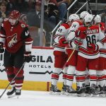 Carolina Hurricanes left wing Jordan Martinook (48) celebrates with teammates after scoring a goal against the Arizona Coyotes during the second period of an NHL hockey game Friday, Nov. 2, 2018, in Glendale, Ariz. (AP Photo/Rick Scuteri)