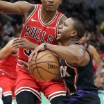 Phoenix Suns guard Isaiah Canaan, right, drives against Chicago Bulls center Wendell Carter Jr., during the first half of an NBA basketball game Wednesday, Nov. 21, 2018, in Chicago. (AP Photo/Nam Y. Huh)