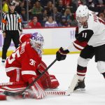 Detroit Red Wings goaltender Jimmy Howard (35) stops an Arizona Coyotes left wing Brendan Perlini (11) shot in the first period of an NHL hockey game Tuesday, Nov. 13, 2018, in Detroit. (AP Photo/Paul Sancya)