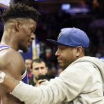 Philadelphia 76ers' Jimmy Butler, left, talks to former 76ers' Allen Iverson at the end of an NBA basketball game against the Phoenix Suns, Monday, Nov. 19, 2018, in Philadelphia. The 76ers beat the Suns 119-114. (AP Photo/Michael Perez)
