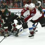 Arizona Coyotes right wing Michael Grabner (40) battles with Colorado Avalanche center Colin Wilson (22) for the puck during the first period of an NHL hockey game Friday, Nov. 23, 2018, in Glendale, Ariz. (AP Photo/Ross D. Franklin)