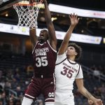 Mississippi State's Aric Holman (35) dunks over Arizona State's Taeshon Cherry (35) during the second half of an NCAA college basketball game, Monday, Nov. 19, 2018, in Las Vegas. (AP Photo/John Locher)