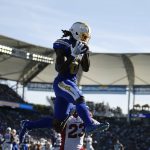 Los Angeles Chargers wide receiver Mike Williams makes a touchdown catch over Arizona Cardinals cornerback Bene' Benwikere (23) during the first half of an NFL football game Sunday, Nov. 25, 2018, in Carson, Calif. (AP Photo/Kelvin Kuo)