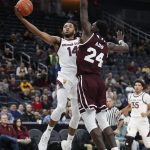 Arizona State's Kimani Lawrence (14) shoots around Mississippi State's Abdul Ado (24) during the first half of a NCAA college basketball game Monday, Nov. 19, 2018, in Las Vegas. (AP Photo/John Locher)