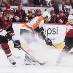 Philadelphia Flyers' Jakub Voracek (93) controls the puck as he's double-teamed by the Arizona Coyotes' Kevin Connauton (44) and Nick Cousins (25)during the first period of an NHL hockey game Monday, Nov. 5, 2018, in Glendale, Ariz. (AP Photo/Darryl Webb)