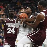 Arizona State's Luguentz Dort (0) drives through Mississippi State's Abdul Ado (24) and Reggie Perry during the first half of a NCAA college basketball game Monday, Nov. 19, 2018, in Las Vegas. (AP Photo/John Locher)
