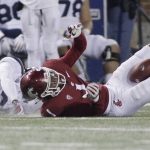 Washington State wide receiver Davontavean Martin (1) hangs on to a pass with his knees against Arizona safety Christian Young during the second half of an NCAA college football game in Pullman, Wash., Saturday, Nov. 17, 2018. Washington State won 69-28. (AP Photo/Young Kwak)