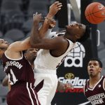 Mississippi State's Quinndary Weatherspoon (11) and Arizona State's Luguentz Dort (0) vie for the ball during the second half of an NCAA college basketball game, Monday, Nov. 19, 2018, in Las Vegas. Arizona State won 72-67. (AP Photo/John Locher)