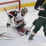 Arizona Coyotes goalie Antti Raanta, left, of Finland, stops a shot by Minnesota Wild's Eric Fehr during the first period of an NHL hockey game Tuesday, Nov. 27, 2018, in St. Paul, Minn. (AP Photo/Jim Mone)
