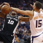 San Antonio Spurs guard DeMar DeRozan (10) is fouled by Phoenix Suns forward Ryan Anderson (15) during the first half of an NBA basketball game, Wednesday, Nov. 14, 2018, in Phoenix. (AP Photo/Matt York)