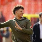 Kansas City Chiefs quarterback Patrick Mahomes warms up while wearing a Salute to Service jersey with a patch to commemorate the 100th anniversary of the WWI armistice, before an NFL football game against the Arizona Cardinals in Kansas City, Mo., Sunday, Nov. 11, 2018. (AP Photo/Charlie Riedel)