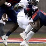 Arizona safety Demetrius Flannigan-Fowles (6) knocks the ball out of the hands of Colorado wide receiver K.D. Nixon, stopping him on fourth and short during the first quarter of an NCAA college football game Friday, Nov. 2, 2018, in Tucson, Ariz. (Kelly Presnell/Arizona Daily Star via AP)