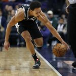 San Antonio Spurs guard Bryn Forbes (11) can't save the loose ball from going out-of-bounds during the first half of an NBA basketball game against the Phoenix Suns, Wednesday, Nov. 14, 2018, in Phoenix. (AP Photo/Matt York)